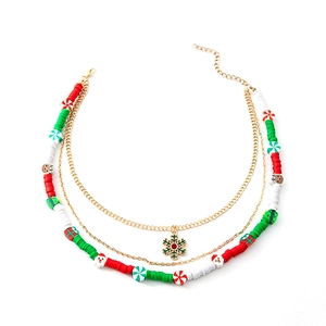 Multi-layer Christmas necklace with gold chain, snowflakes, and festive beaded charms