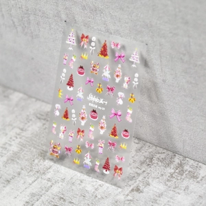 Detail of 3D embossed Christmas nail stickers with tree and bow patterns on model WY-19