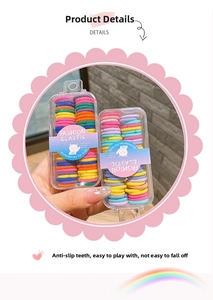 Detail of colorful elastic hair bands for kids in a portable plastic storage box