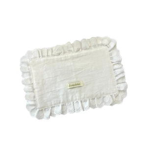 Rectangular cream cotton placemat with elegant lace borders and a minimalist aesthetic
