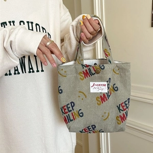 Corduroy tote bag in sage green with smile face and Keep Smiling text print