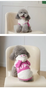 Detail of pink and white plush dog hoodie with PUP embroidery and dotted hood