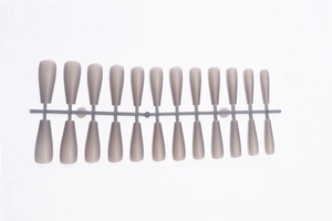 Detail view of long matte gray-purple ballet style press-on nails set on a white background