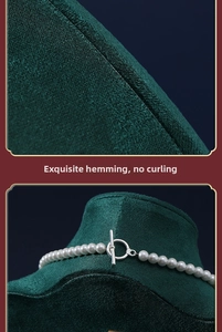 Detail of white pearl necklace with silver toggle clasp on green velvet display