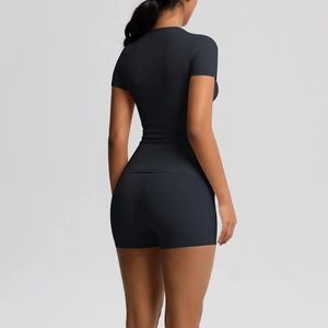 Rear view of tight-fitting black yoga set showing seamless fabric and athletic cut