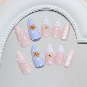 Blue and pink sea star press-on nails with 3D pearls and ocean wave French almond tips