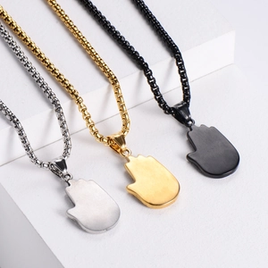 Minimalist stainless steel palm pendants in silver, gold, and black finishes on white