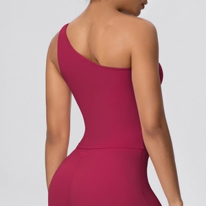 Detail of burgundy one-shoulder sports bra showing high-elasticity fabric and slim fit design