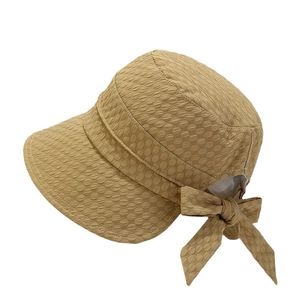Khaki bow sun hat for women with textured fabric and foldable bucket design for beach