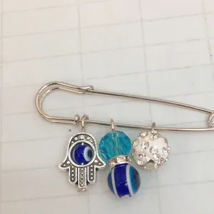 Silver Hamsa Hand and Evil Eye safety pin brooch with blue beads and rhinestones