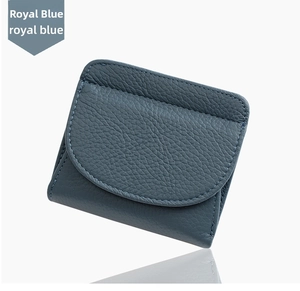Close-up of royal blue leather wallet featuring fine stitching and litchi grain texture
