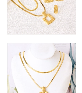 Detail of layered gold snake chain necklace with square hammered pendant and matching earrings