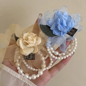 Elegant mesh rose flower hair claw clip with pearl chain detail in beige and blue