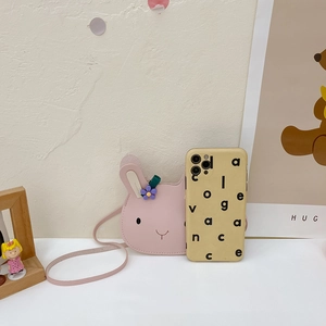 Pink rabbit-shaped toddler crossbody bag with decorative floral ears and matching strap
