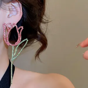 Elegant long tulip earrings with pink crystals and green leaves on silver studs