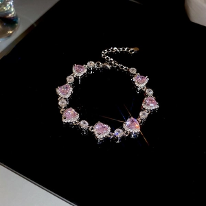 Detailed view of pink zircon heart bracelet with sparkling silver chain and extension