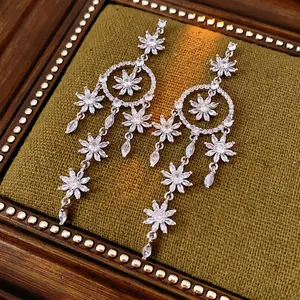 Silver flower tassel earrings with zircons and floral motifs in a velvet box