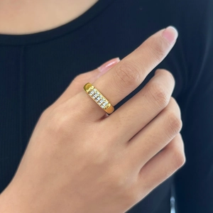Elegance 18K gold plated stainless steel ring with cubic zirconia worn by a model