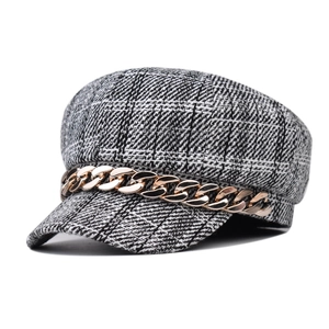 Classic black and white plaid newsboy cap with gold chain detail for women