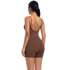 Detail of brown backless yoga bodysuit with thin straps and a slim fit design