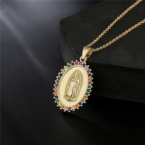 Gold Virgin Mary oval pendant necklace with rainbow cubic zirconia on black mirror base