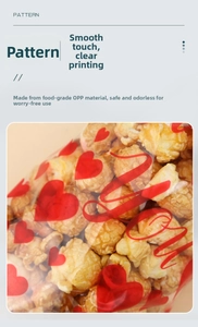 Food-grade OPP candy bag with red heart patterns shown filled with popcorn