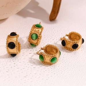 Detailed view of retro 18K gold-plated beaded hoop earrings with green and black stones