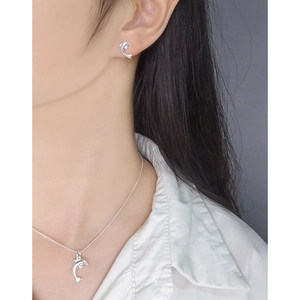 S925 sterling silver dolphin necklace and stud earrings set worn by a female model