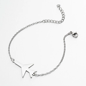 Detailed macro view of the silver stainless steel chain with a minimalist airplane pendant