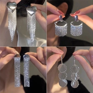Detail of assorted silver tassel earrings with rhinestones and long fringe designs