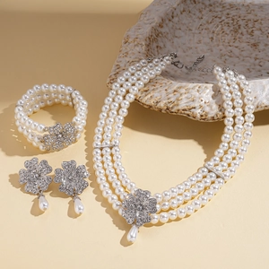 Detailed set of multi-layer baroque pearl necklace and earrings with rhinestone flowers