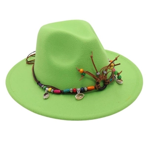 Detail of neon green fedora hat featuring ethnic colorful beads and natural seashells
