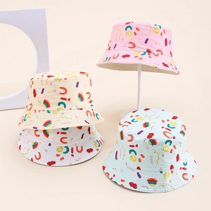 Detailed close-up of cute cartoon cotton sun hats for children in multiple soft colors