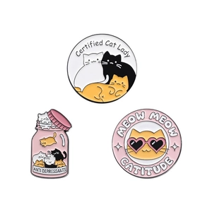 Three-piece set of cartoon cat enamel pins with Creative English text on white background