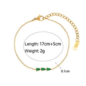Detailed view of 18K gold plated bracelet with three green pear-shaped gemstones and sizing