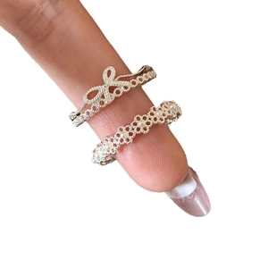 Elegant silver open ring set with zircon bow, floral pattern, and white pearls