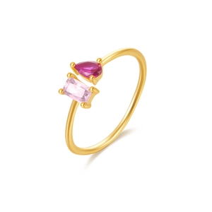 Detail of golden open ring featuring a magenta teardrop and pink rectangular gemstone