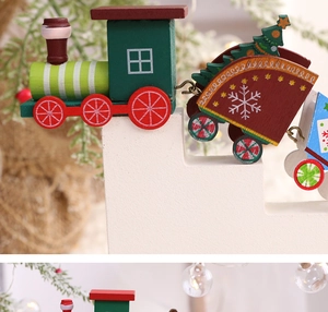 Detail of wooden Christmas train decor with hand-painted snowflakes on white steps