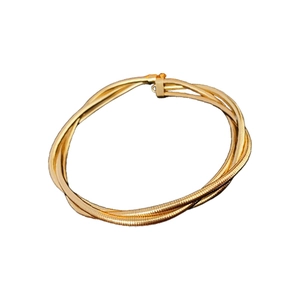 Bracelet enveloppant doré à plusieurs brins avec texture serpent et ressort métallique