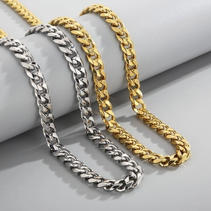 Detailed view of classic gold and silver Cuban link chains with polished finish