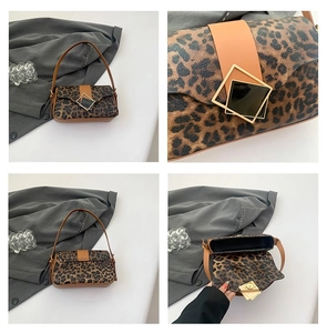 Detailed views of leopard print underarm bag with gold buckle and leather stitching