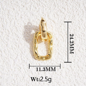 Detailed view of 18K gold rectangle clasps with smooth and hammered metal textures