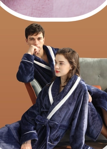 Detail of soft flannel couple robes with white contrast trim and waist tie closure