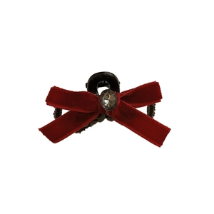 Deep red velvet bow hair claw clip with a sparkling rhinestone center on white background