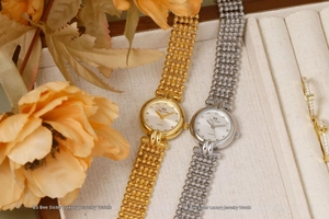 Detailed view of luxury women's quartz watches with gold and silver beaded metal bands