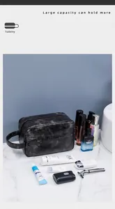 Detail view of large capacity dark grey PU leather toiletry bag with side handle