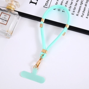 Close-up of mint green nylon phone lanyard with gold metal buckle on a white background