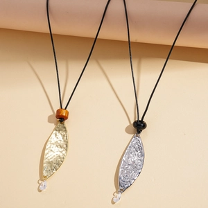 Vintage leather leaf necklace with gold and silver hammered pendants and wooden beads