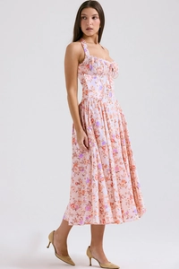 Detail showing peach pink floral print and delicate lace bodice on a midi summer dress