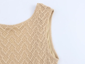 Detailed macro view of the knitted shoulder and crew neck with textured lace fabric
